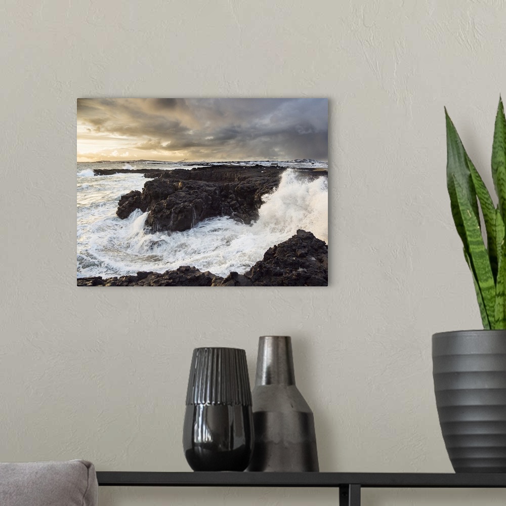 A modern room featuring Coastline at Brimketill during stormy conditions at sunset. The coast of the north Atlantic on Re...