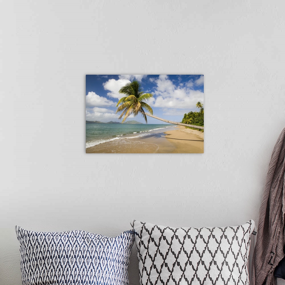 A bohemian room featuring Coconut Grove Beach at Cades Bay, with St. Kitts on horizon
