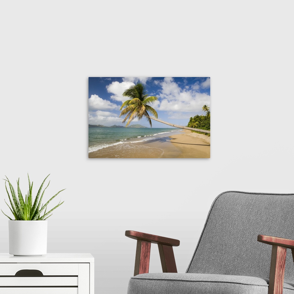 A modern room featuring Coconut Grove Beach at Cades Bay, with St. Kitts on horizon