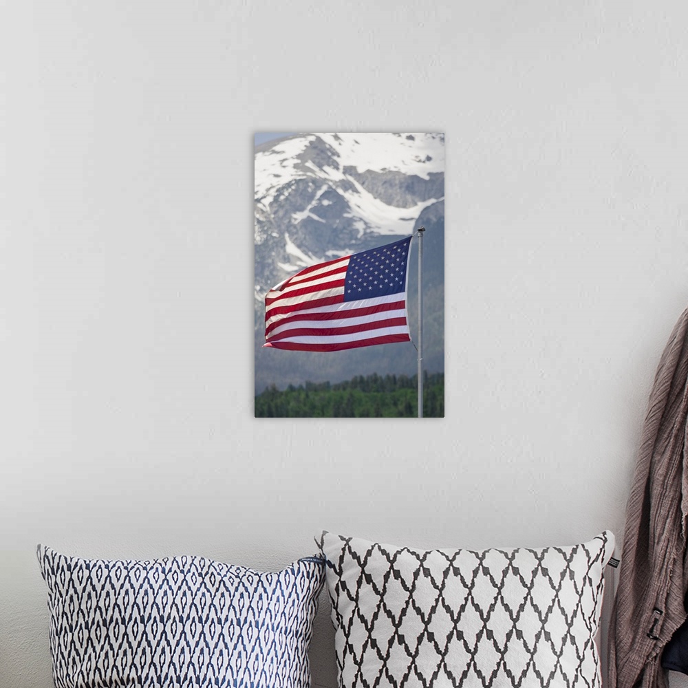 A bohemian room featuring USA, Colorado, Silverthorne. American flag flying against mountain backdrop.