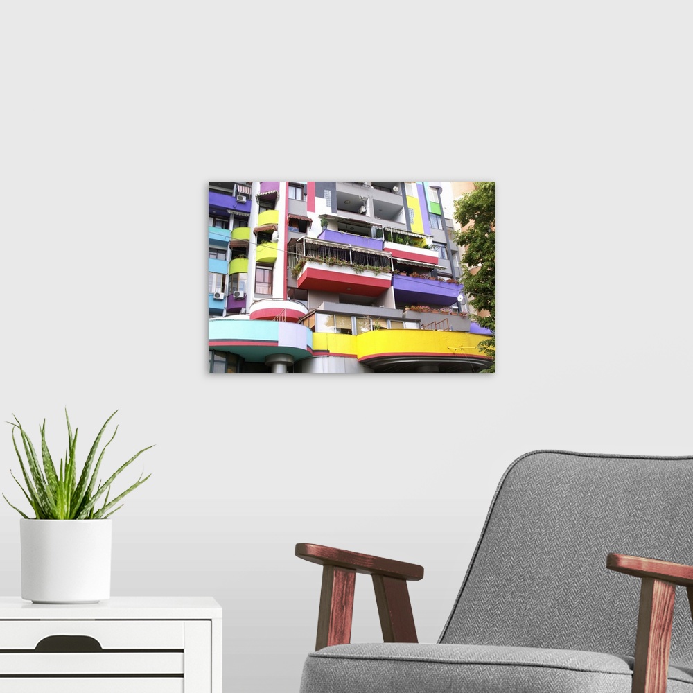 A modern room featuring Detail with balconies of A very colourful building. Street scene from the part of the city called...