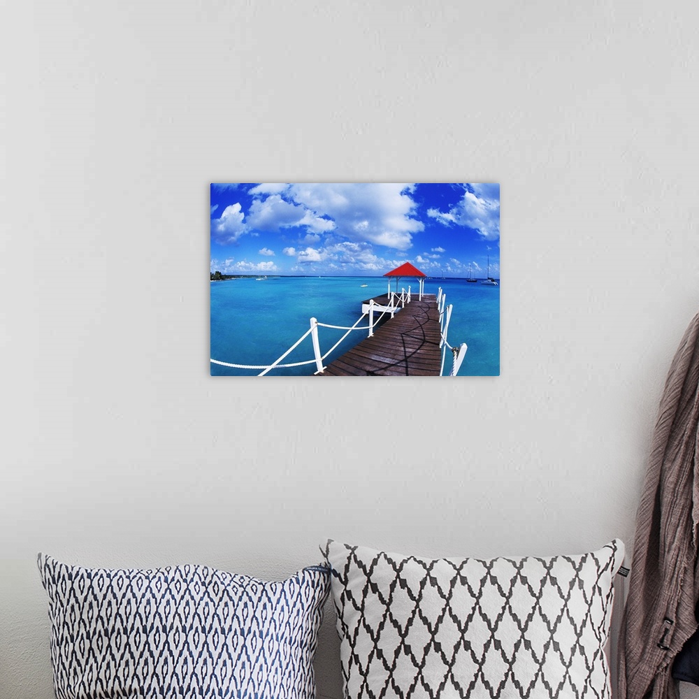 A bohemian room featuring Colorful graphic of dock in St. Francois, Guadeloupe.