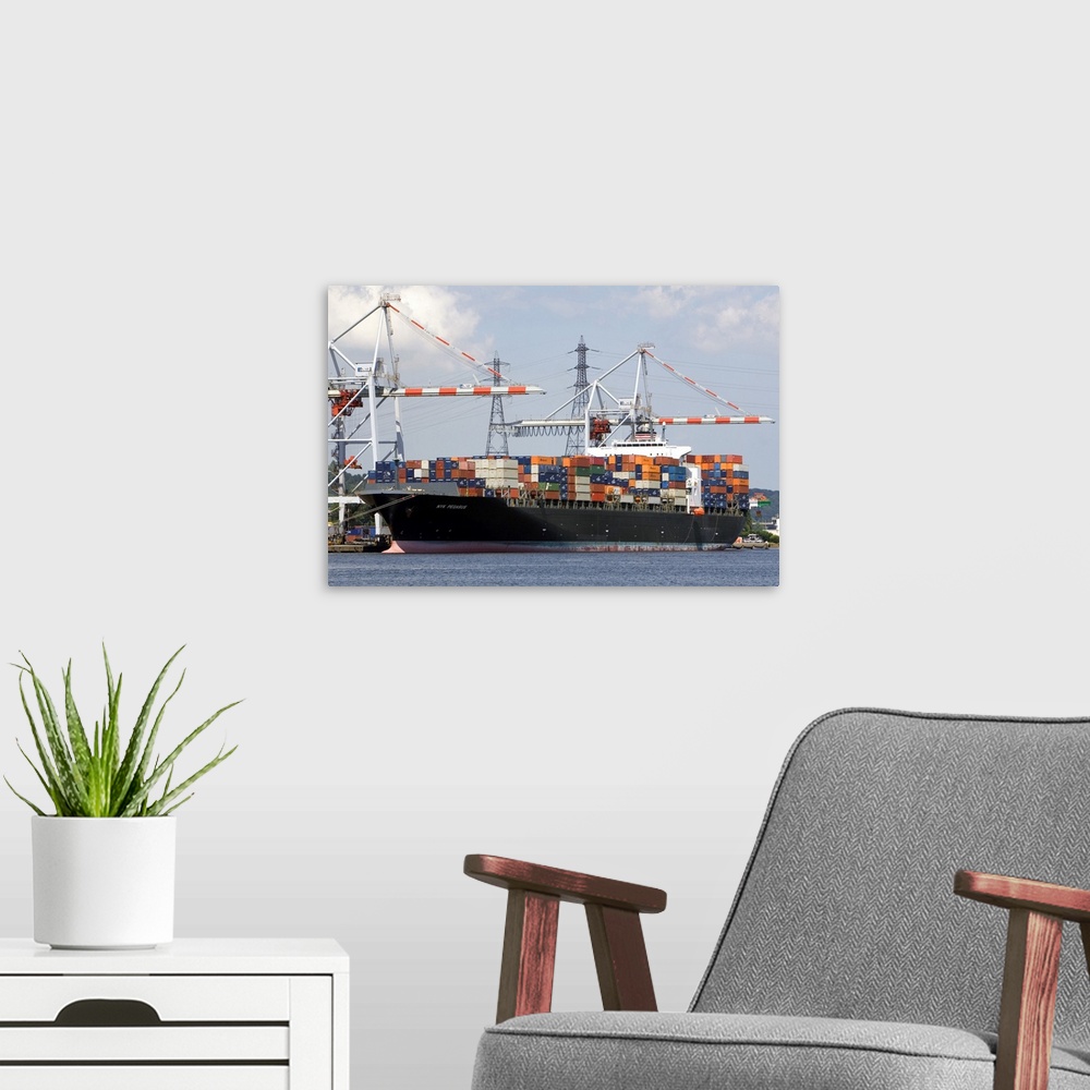 A modern room featuring Container ship docked at Le Havre in the department of Seine-Maritime, Normandy, France.