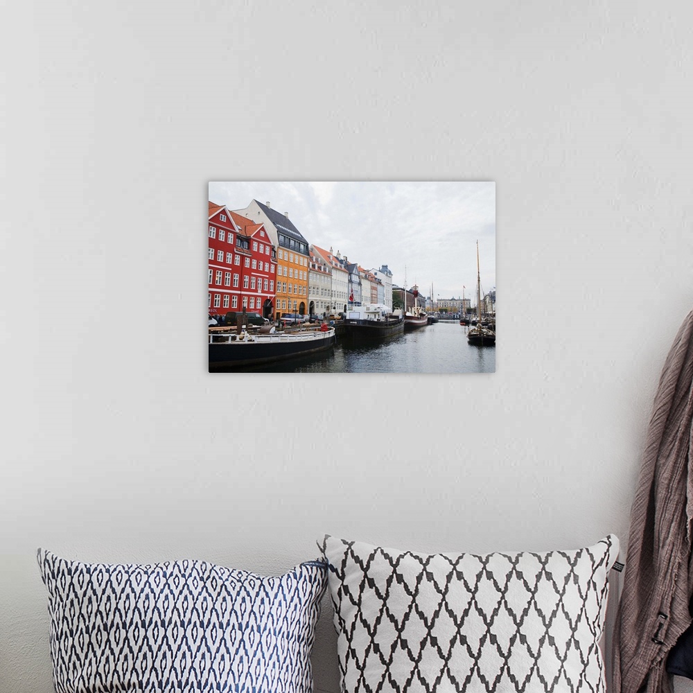 A bohemian room featuring Copenhagen, Denmark - On old world, waterfront city. Boats are viewable on the water. Horizontal ...