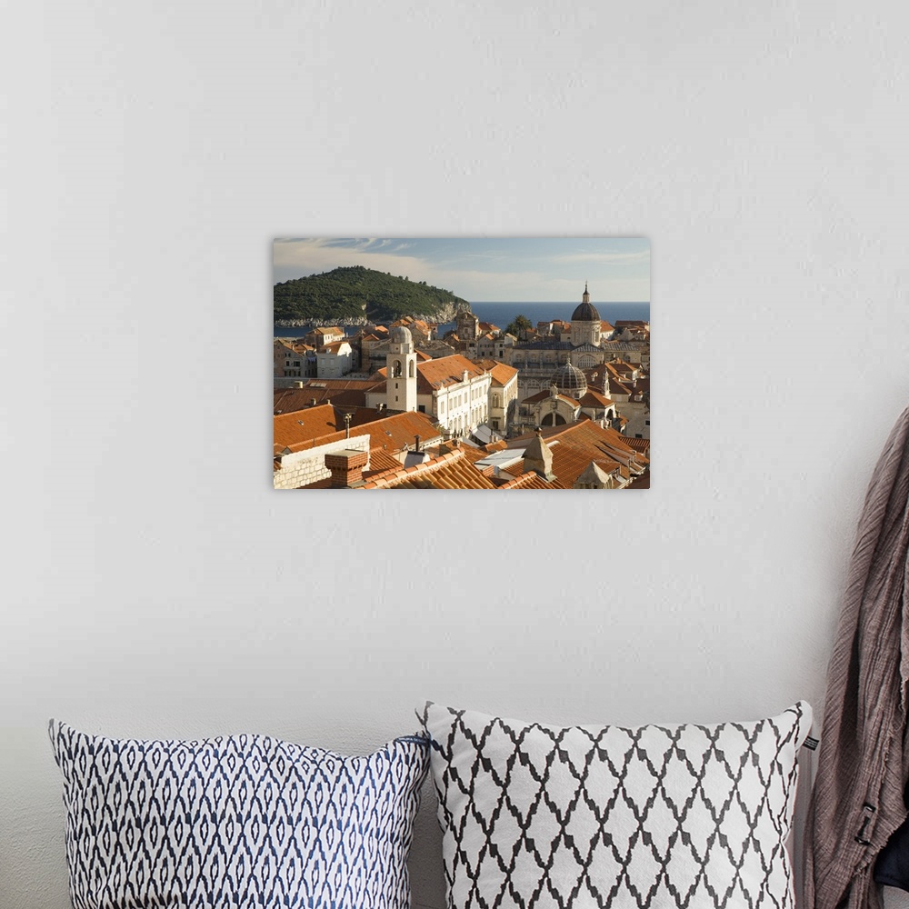 A bohemian room featuring Europe, Croatia, Dalmatia, Dubrovnik.  Red tile roofs dominate the old city of Dubrovnik, viewed ...