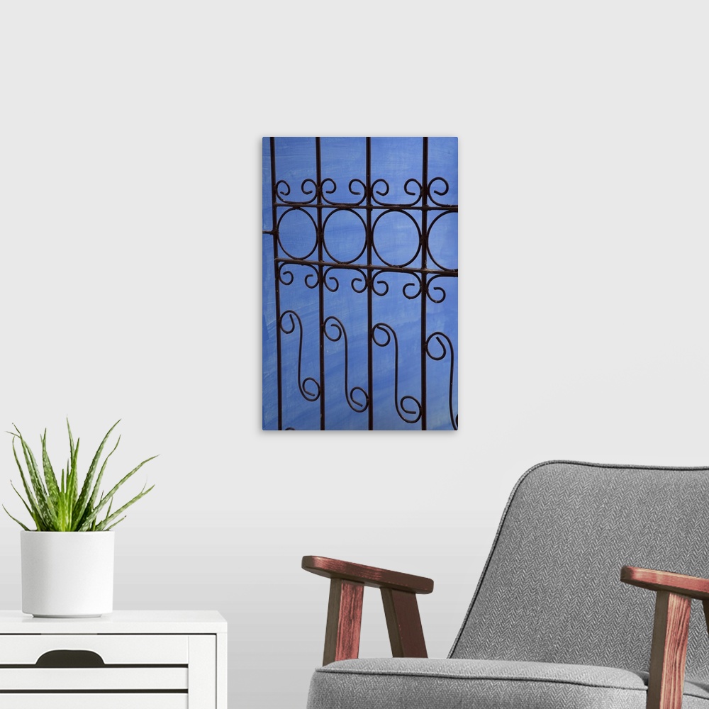 A modern room featuring Cuba, Vinales, wrought iron gate and blue wall.
