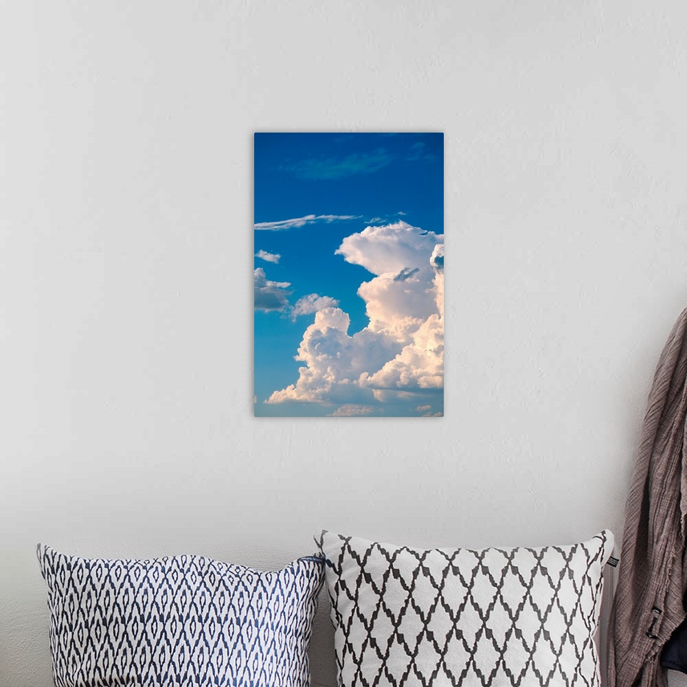 A bohemian room featuring Cumulus clouds in a blue sky.