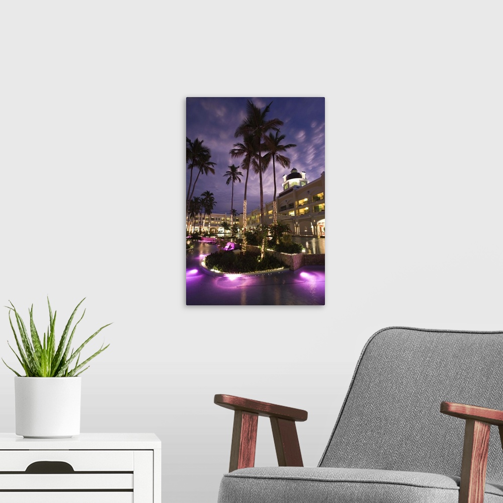 A modern room featuring Dominican Republic, Punta Cana Region, Bavaro, Iberostar Grand Hotel, exterior, evening