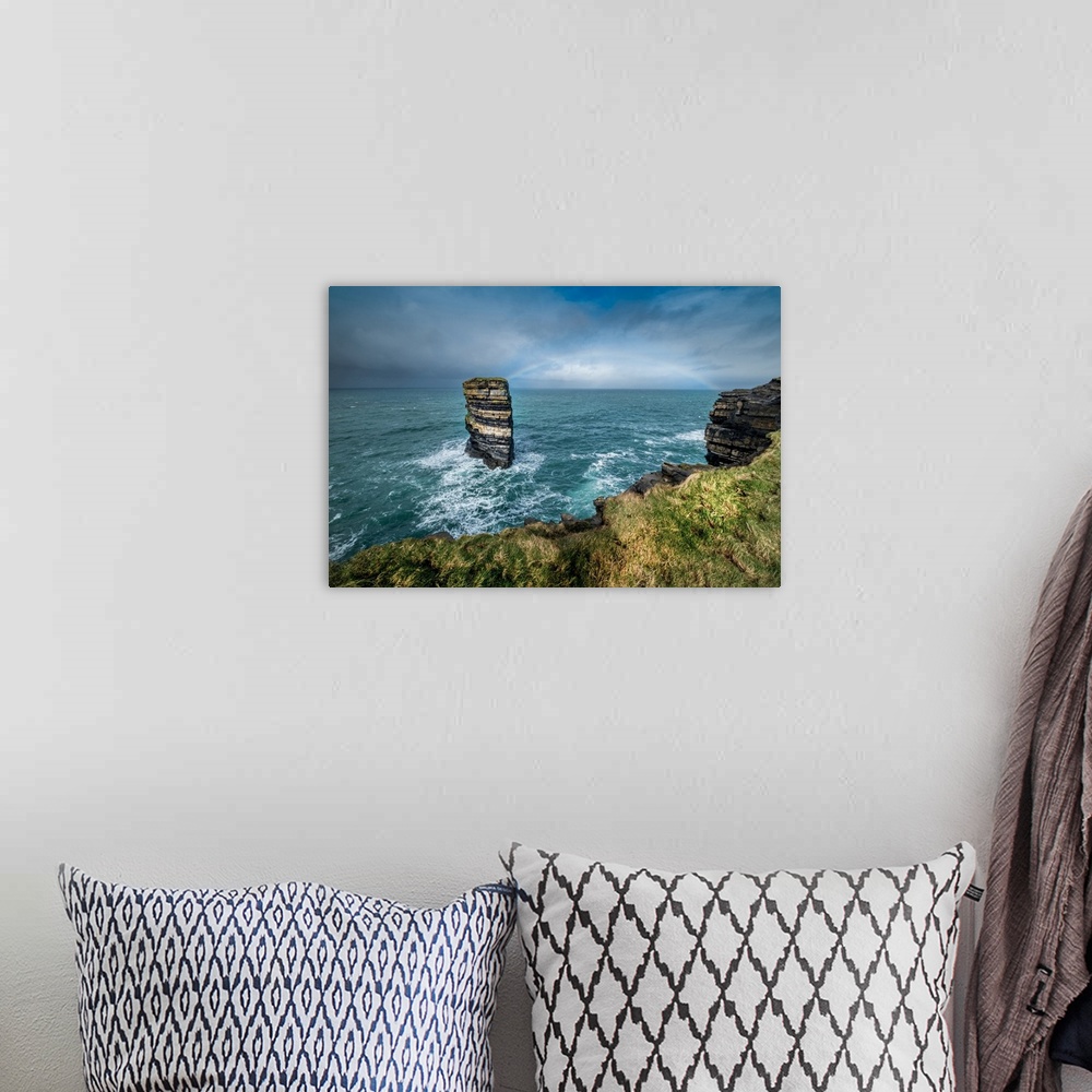 A bohemian room featuring Dun Briste Sea Stack resists the onslaught of the stormy Atlantic Ocean, County Mayo, Ireland.