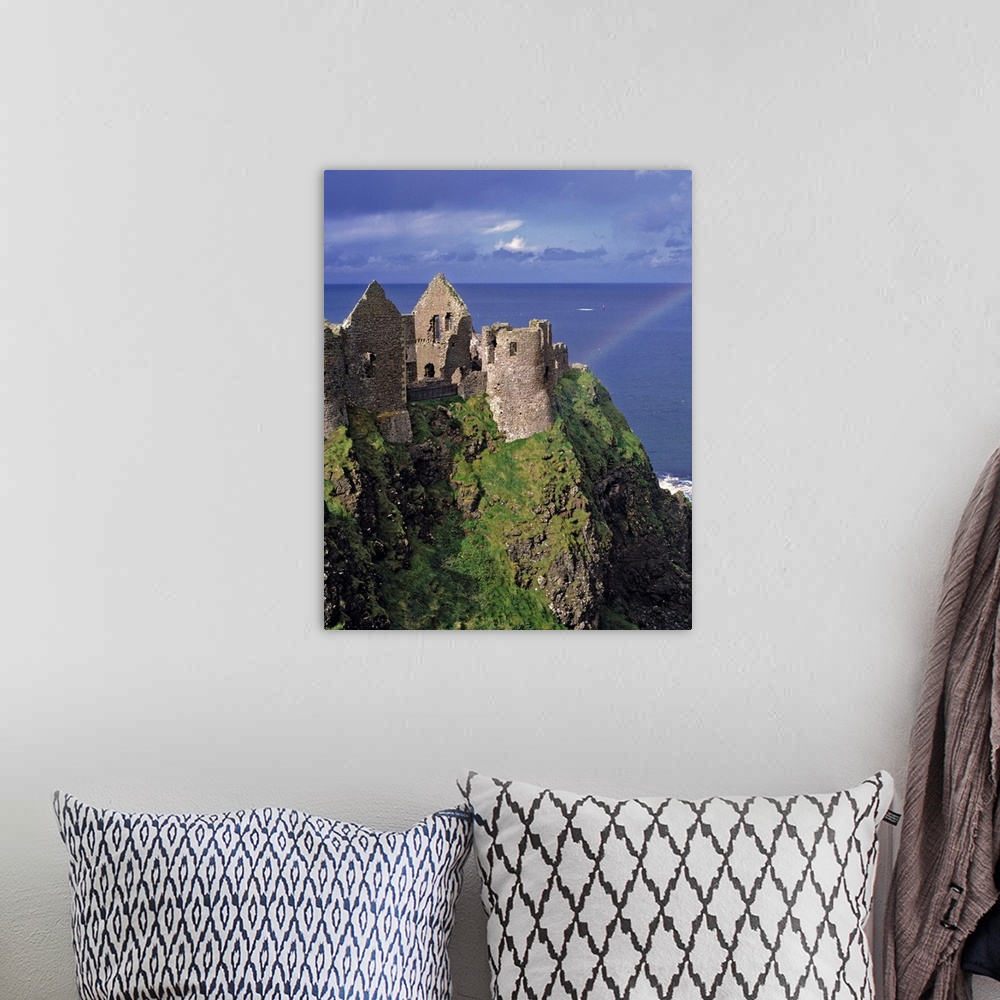 A bohemian room featuring Dunluce Castle on the Antrim Coast in Co. Antrim in Northern Ireland has the pot at the end of th...