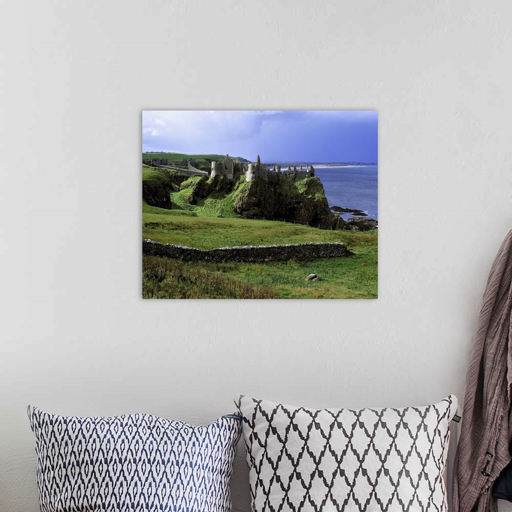 A bohemian room featuring Northern Ireland, County Antrim, Dunluce Castle. Dunluce Castle rises from the emerald hills on N...