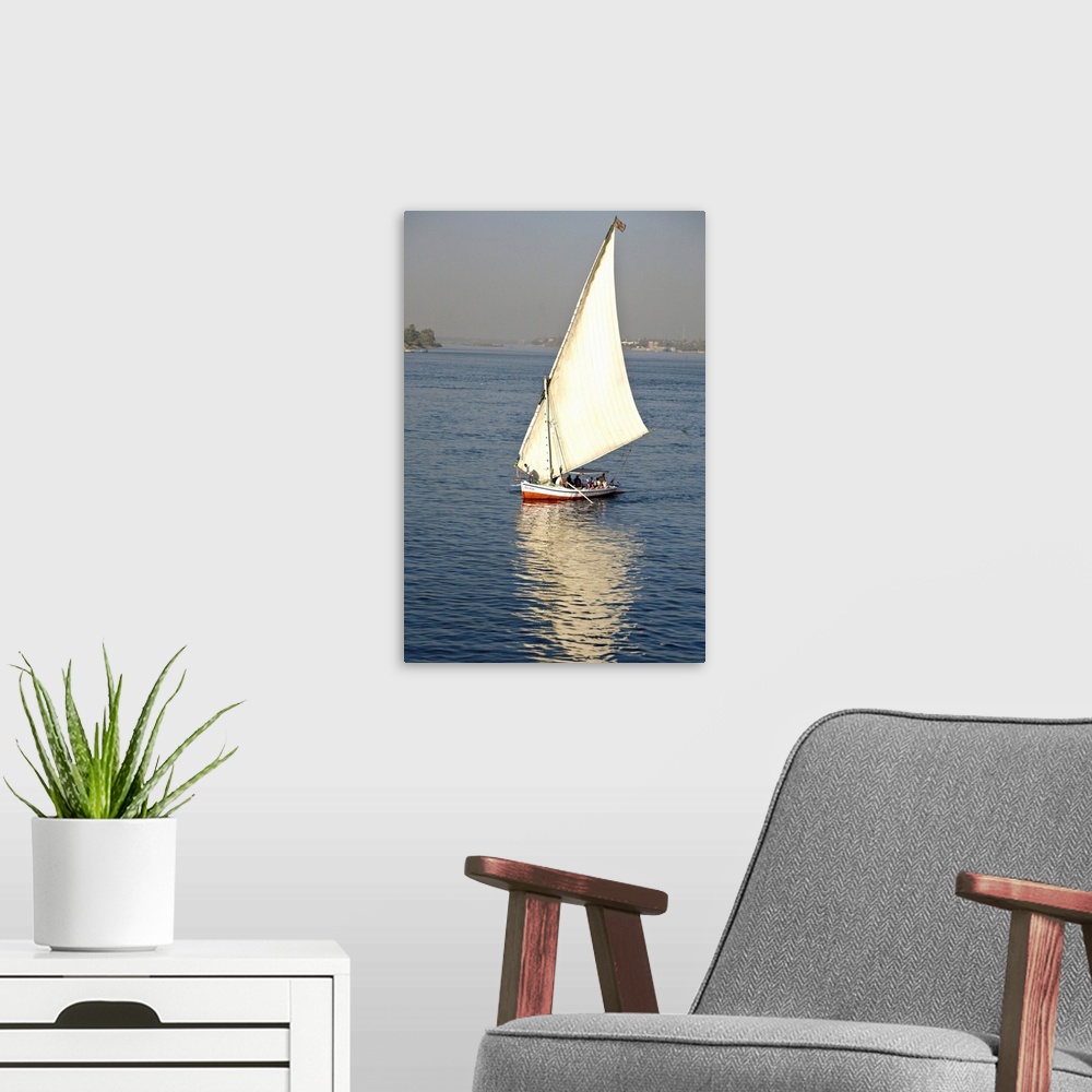 A modern room featuring EGYPT, Luxor. A felluca sailboat on the waters of the Nile.
