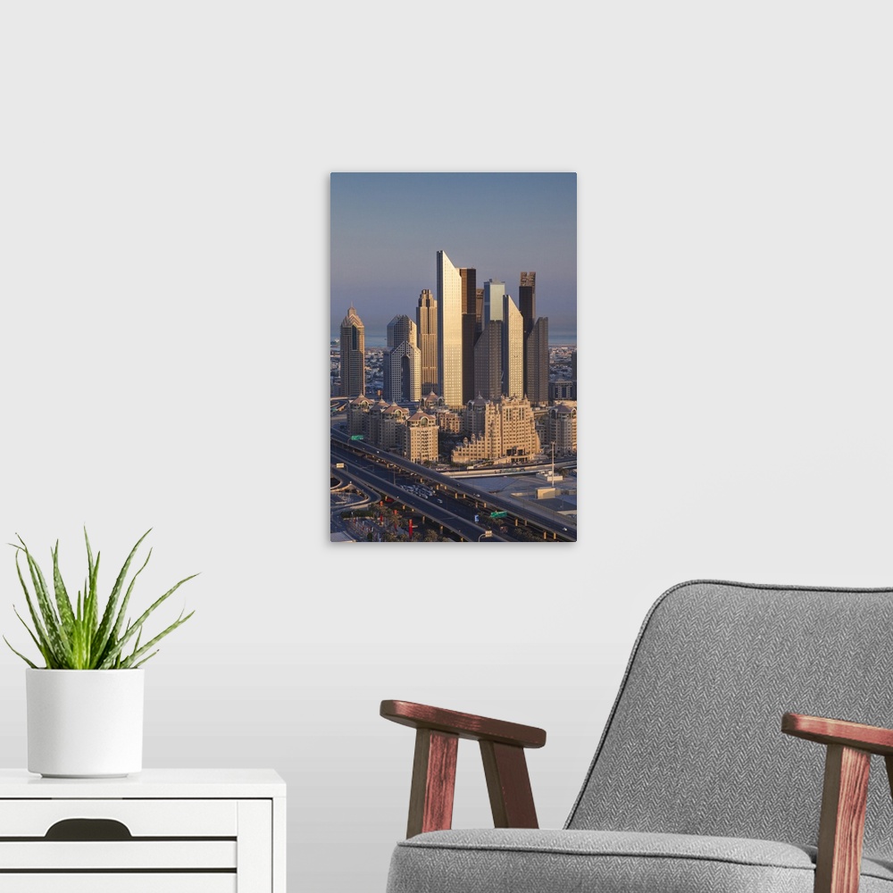 A modern room featuring UAE, Dubai, Downtown Dubai, elevated view of skyscrapers on Sheikh Zayed Road from downtown, dawn