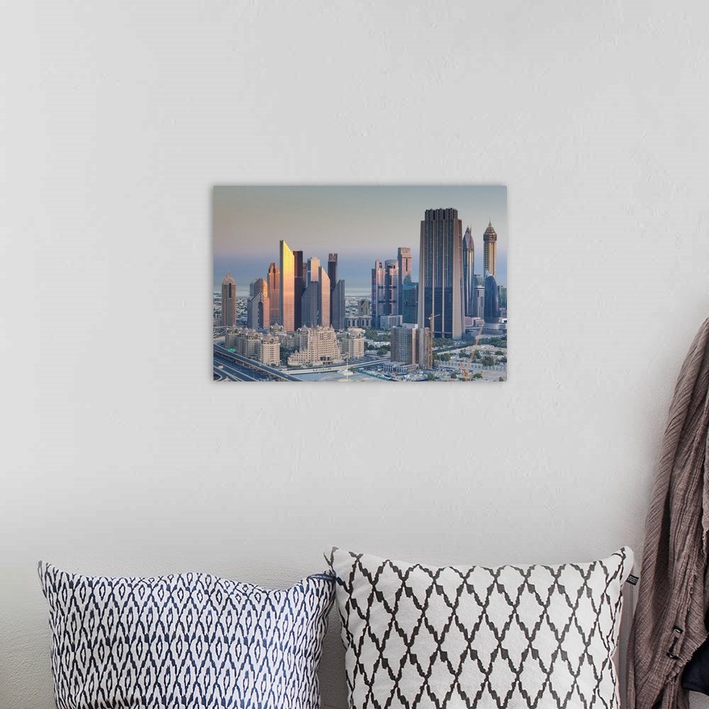A bohemian room featuring UAE, Dubai, Downtown Dubai, elevated view of skyscrapers on Sheikh Zayed Road from downtown, dawn
