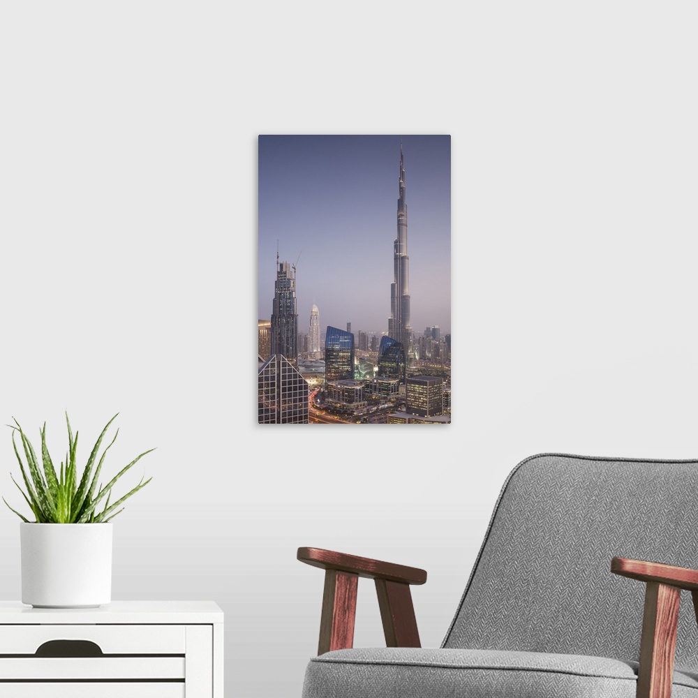 A modern room featuring UAE, Dubai, Downtown Dubai, elevated view over Sheikh Zayed Road and Burj Khalifa Tower, world's ...