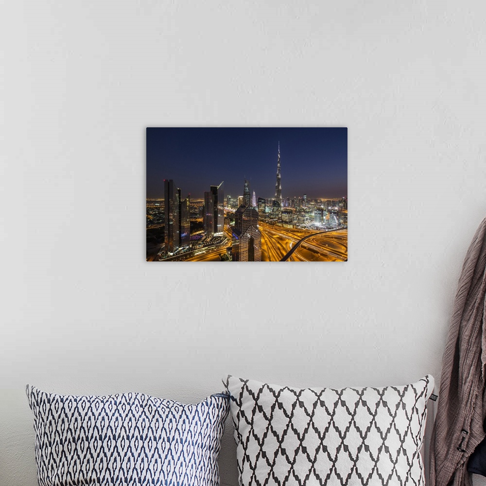 A bohemian room featuring UAE, Dubai, Downtown Dubai, eleavted view over Sheikh Zayed Road and Burj Khalifa Tower, world's ...