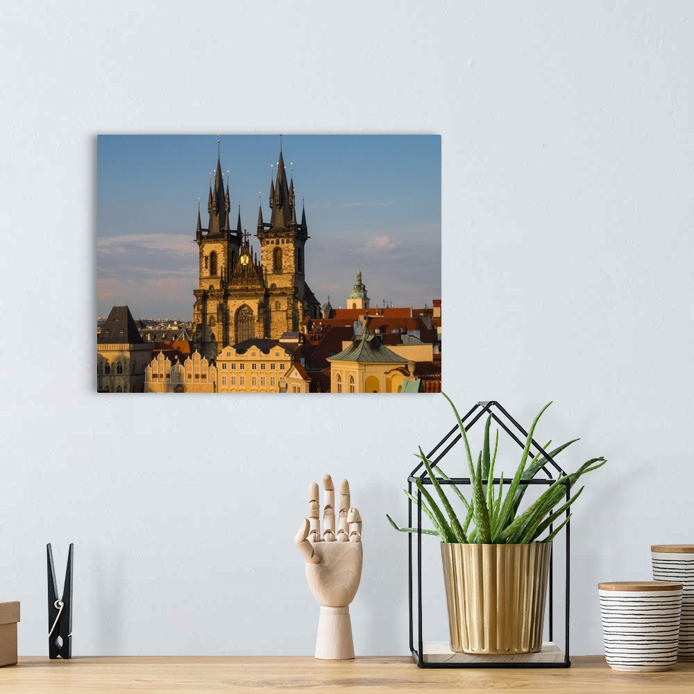A bohemian room featuring Europe, Czech Republic, Prague. Tyn Church, founded in 1385, dominates one side of the Old Town S...