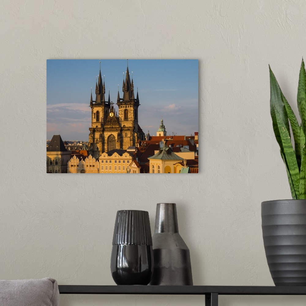 A modern room featuring Europe, Czech Republic, Prague. Tyn Church, founded in 1385, dominates one side of the Old Town S...