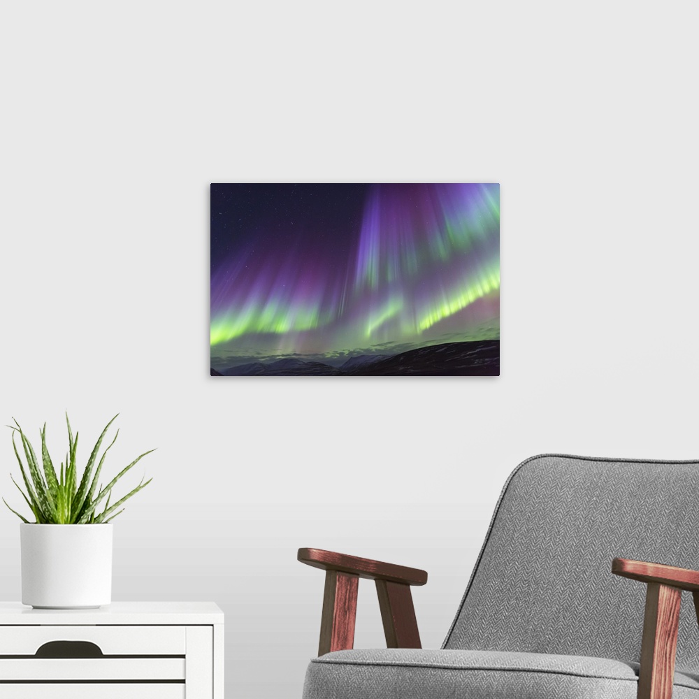 A modern room featuring Europe, Iceland, North Iceland, Near Akureyri. The northern lights glow in unbelievable colors.