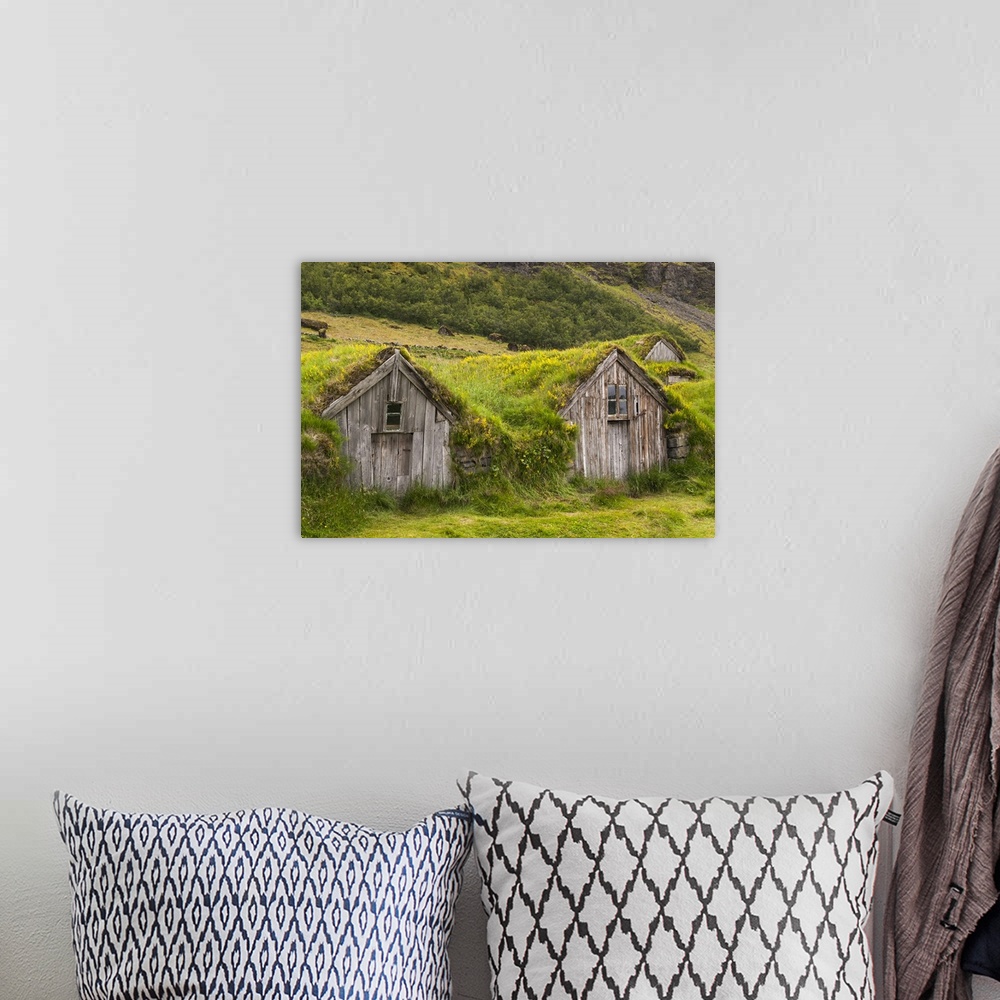 A bohemian room featuring Europe, Iceland, Southeast Iceland, Nupsstadur Turf Farmsted. Old homes covered with turf for pro...