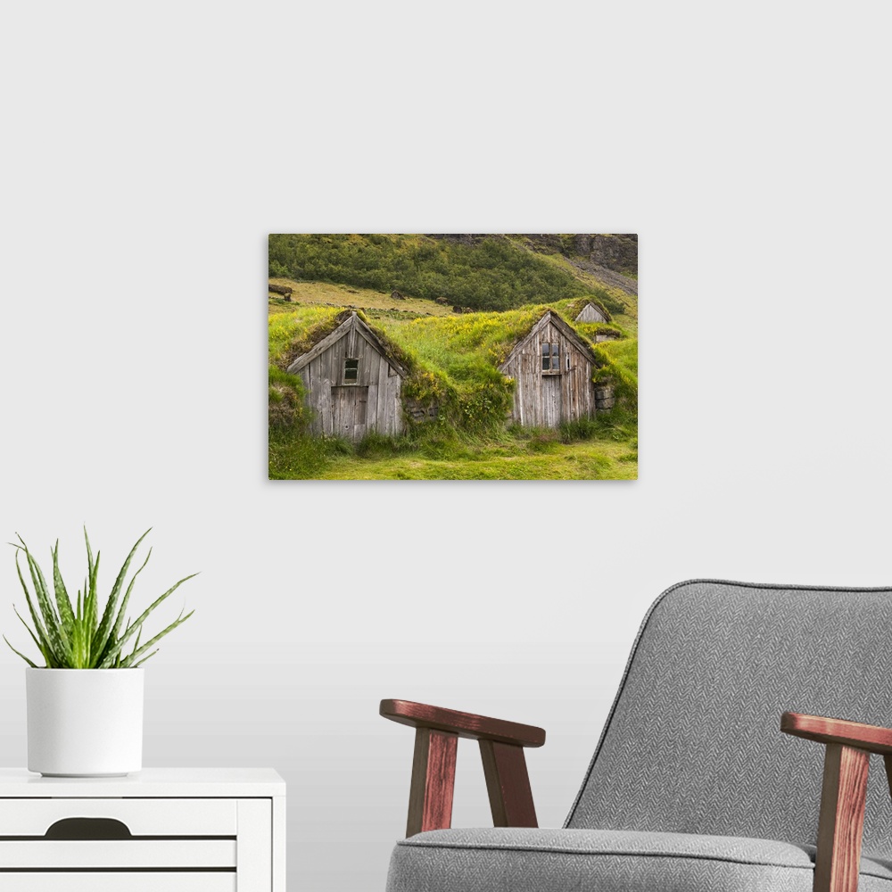 A modern room featuring Europe, Iceland, Southeast Iceland, Nupsstadur Turf Farmsted. Old homes covered with turf for pro...