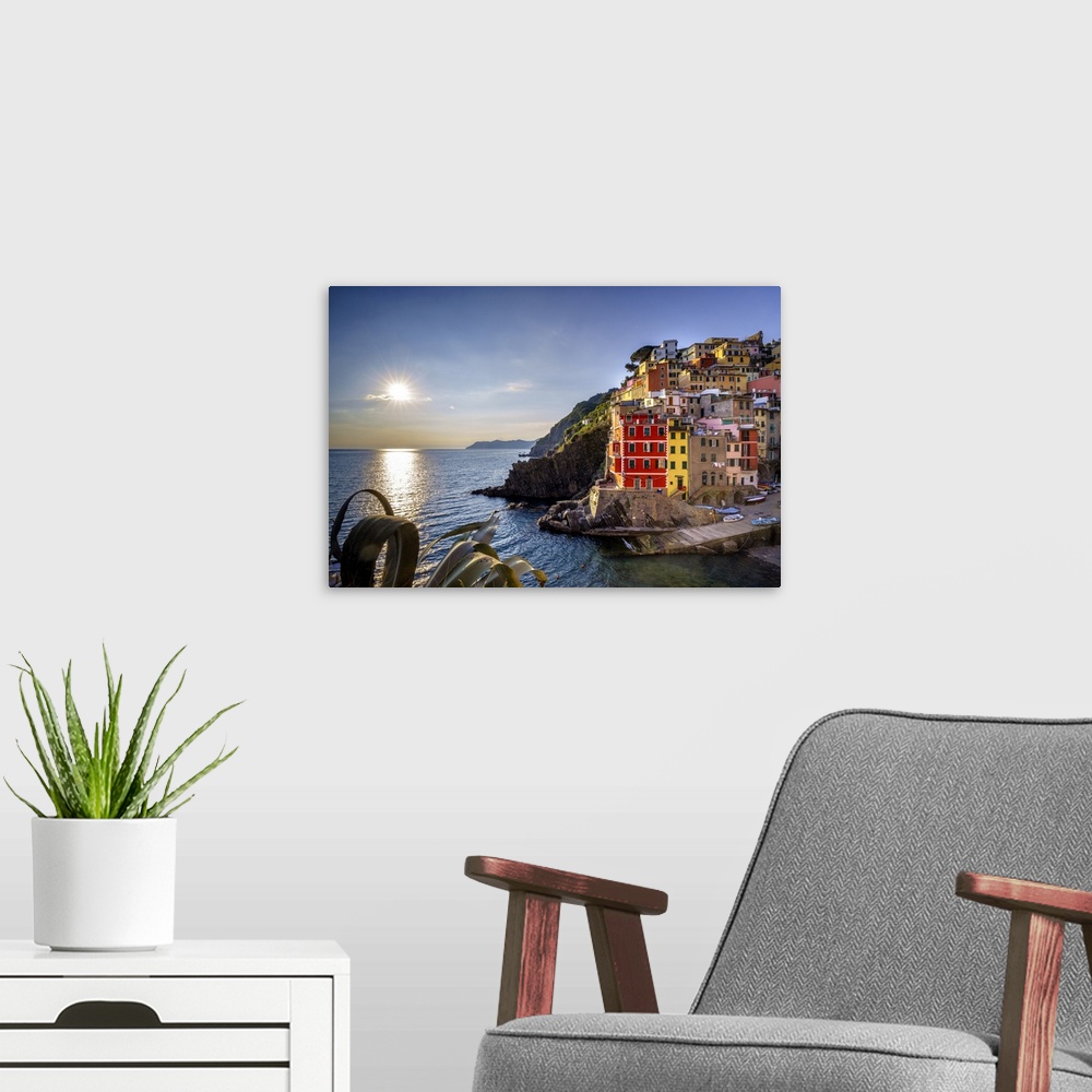 A modern room featuring Europe, Italy, Riomaggiore. Sunset on coastal town. Credit: Jim Nilsen