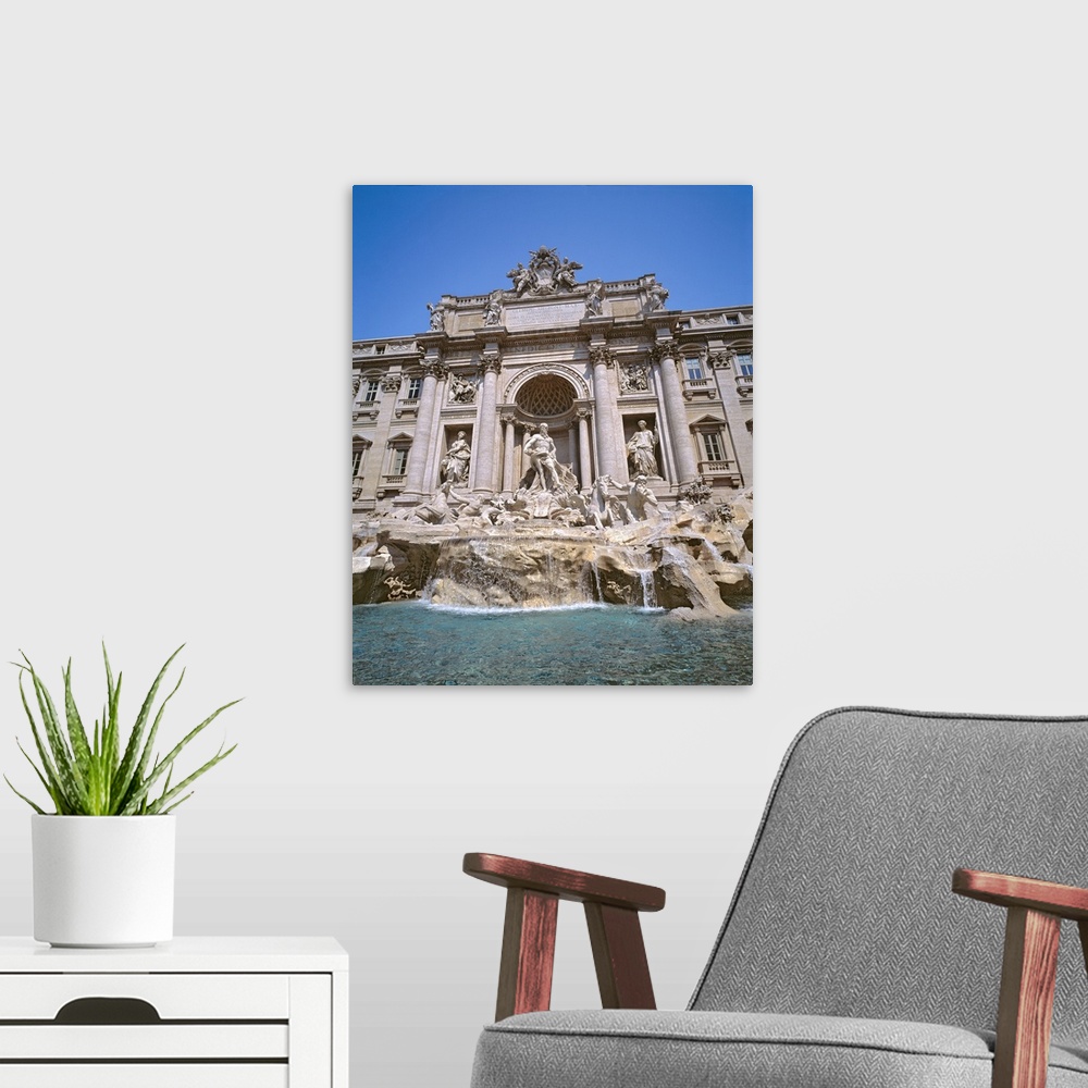 A modern room featuring Europe, Italy, Rome. Coins collect in the waters of Trevi Fountain in Rome, Italy.