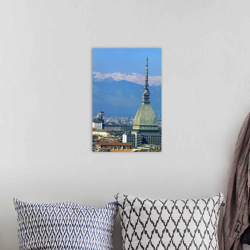 A bohemian room featuring Europe, Italy, Turin.  The tower of the Mole with the snow capped peaks of the Dolomites.