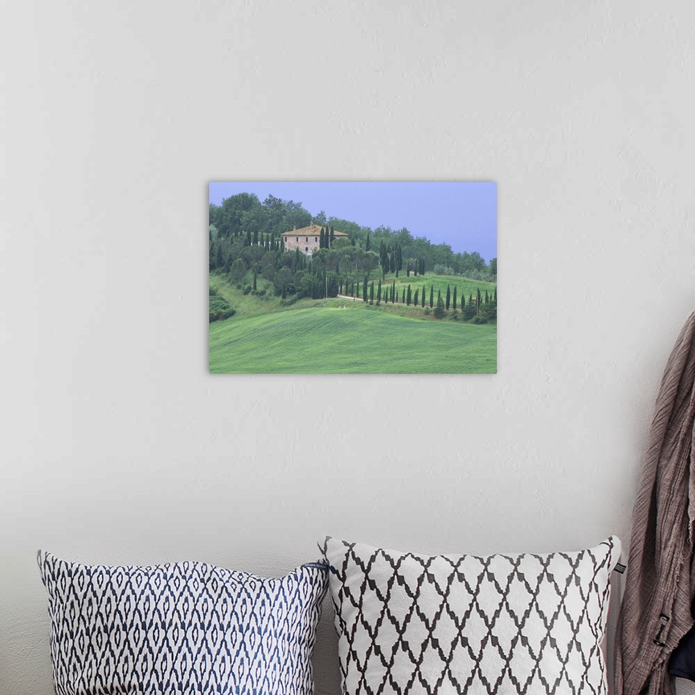 A bohemian room featuring Europe, Italy, Tuscany.  Villa on tree lined hillside in Tuscany.