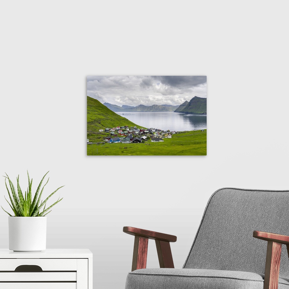 A modern room featuring Village Funningur , in the background Funningsfjordur, Leiriksfjordur and the island Kalsoy. The ...