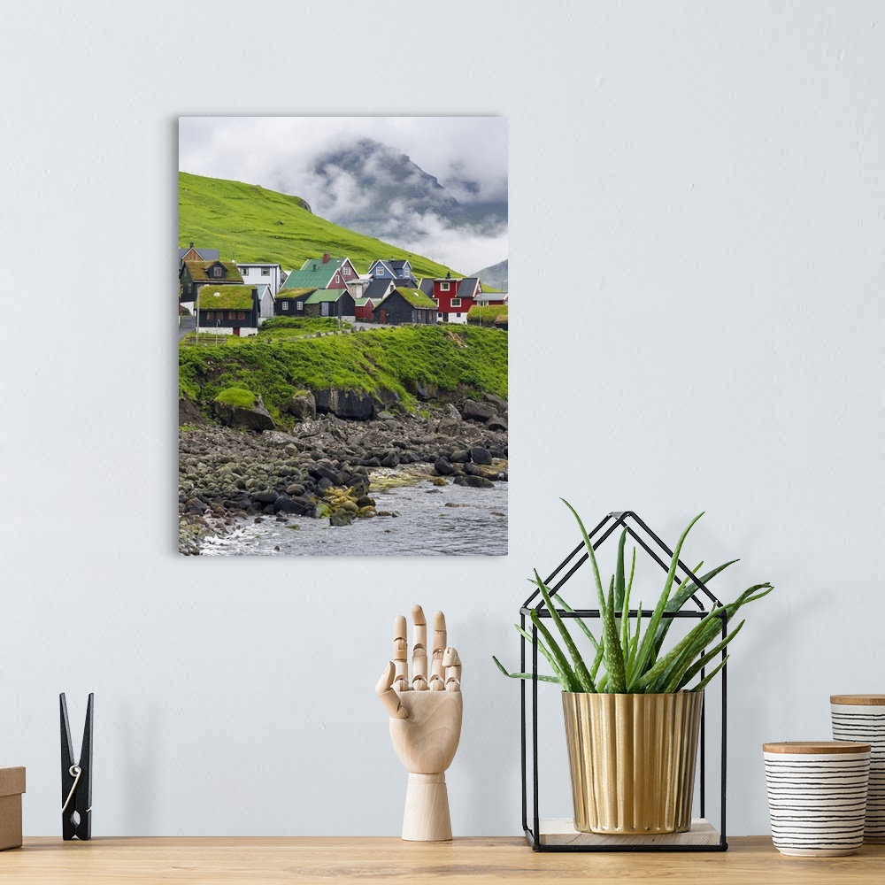 A bohemian room featuring Village Elduvik located at fjord Funningsfjordur. The island Eysturoy one of the two large island...