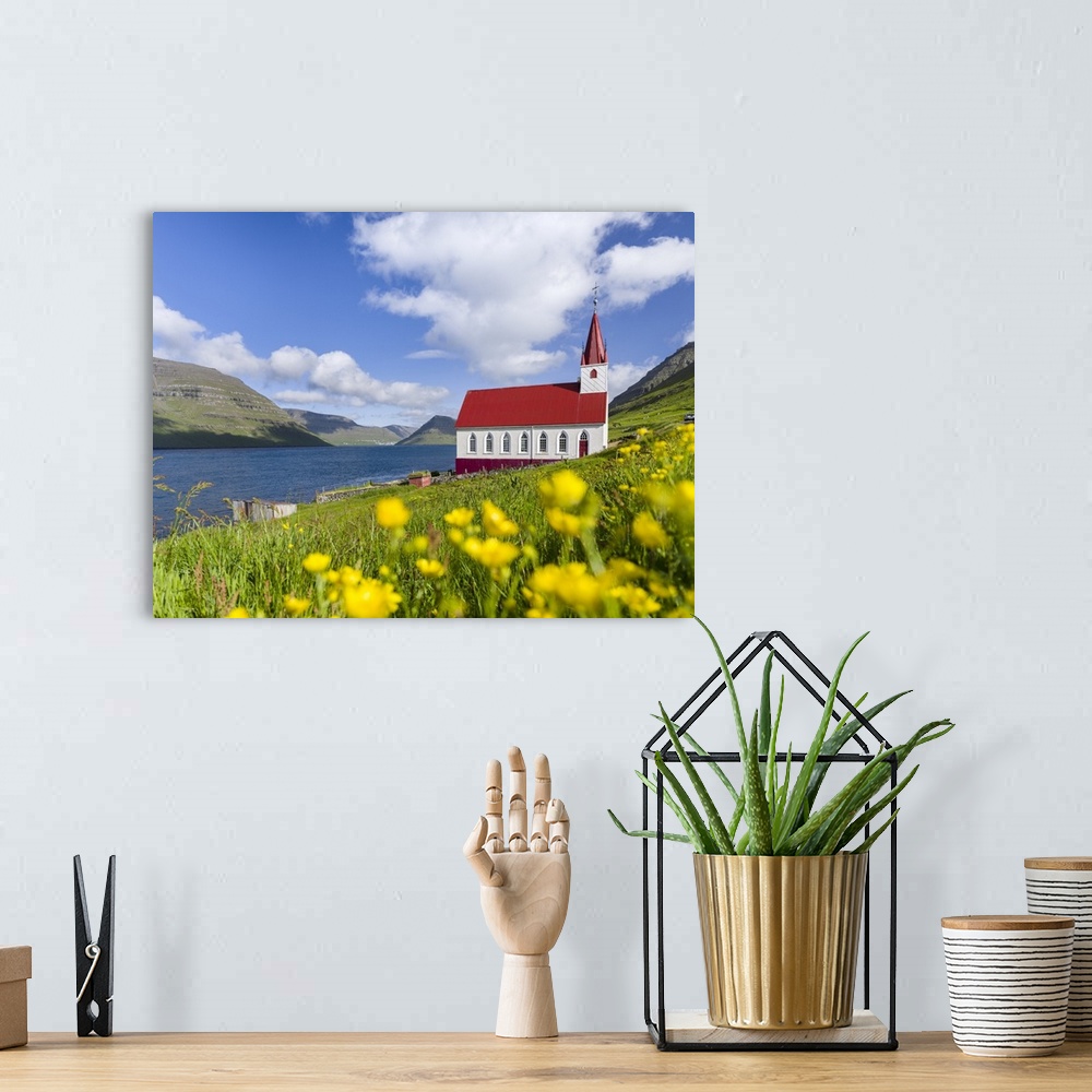 A bohemian room featuring The church in village Husar on Kalsoy, in the background the island of Bordoy and Klaksvik. Nordo...