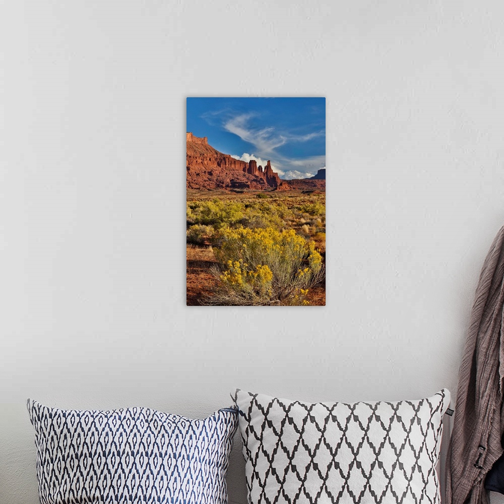 A bohemian room featuring Fisher Towers, Utah in evening light
