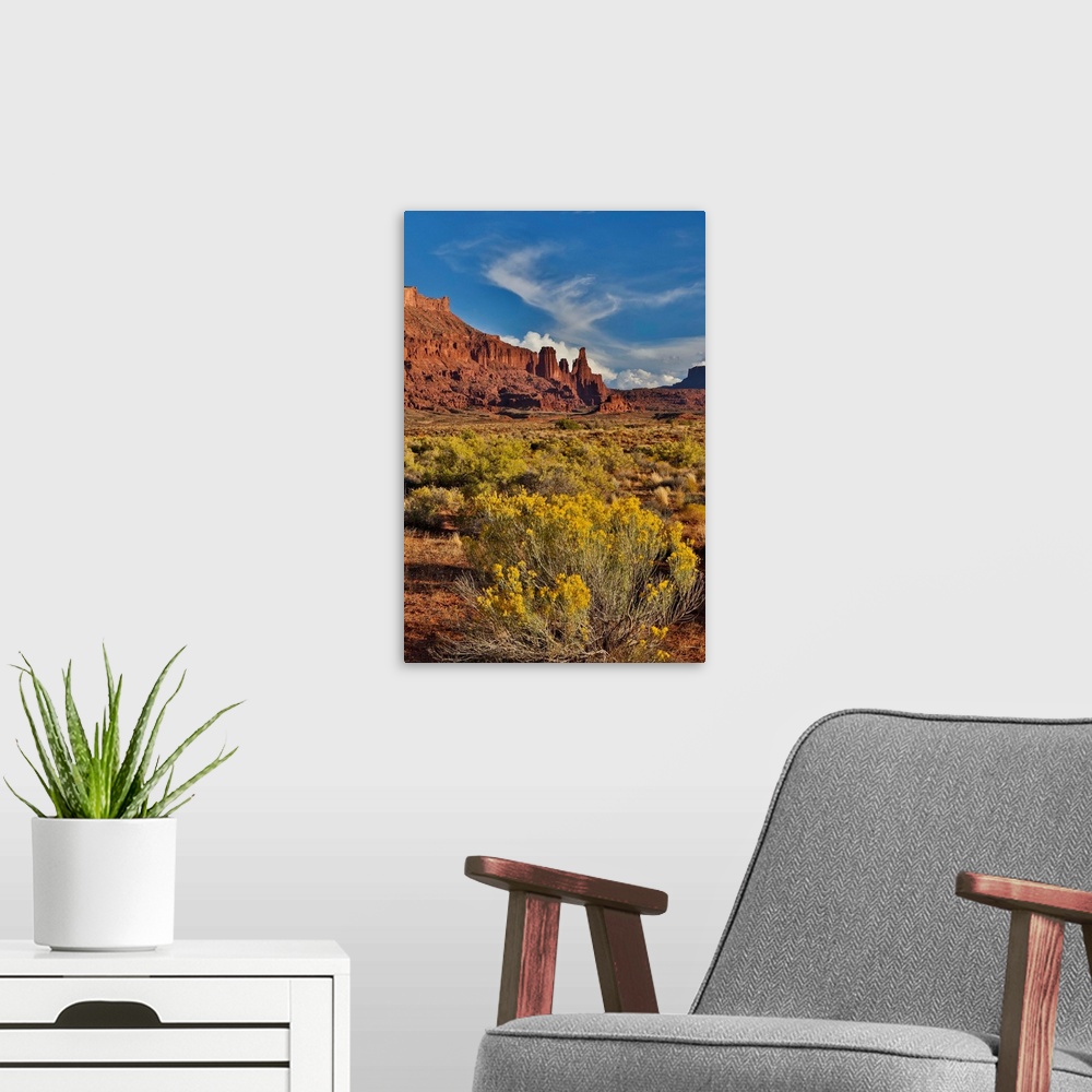 A modern room featuring Fisher Towers, Utah in evening light