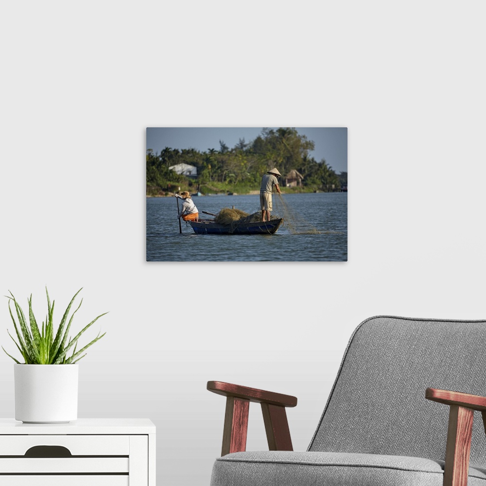 A modern room featuring Fishing from boat on Thu Bon River, Hoi An (UNESCO World Heritage Site), Vietnam