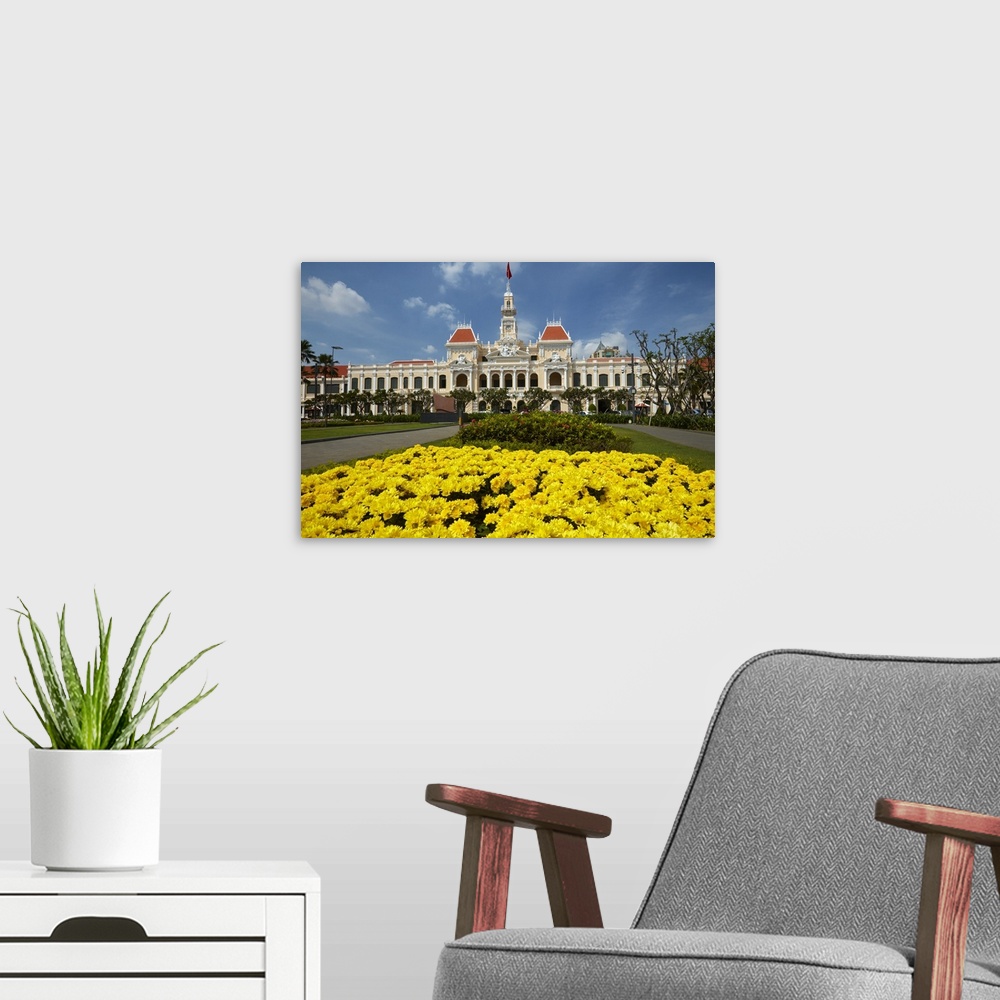 A modern room featuring Flowers and historic People's Committee Building (former Hotel de Ville de Saigon), Ho Chi Minh C...