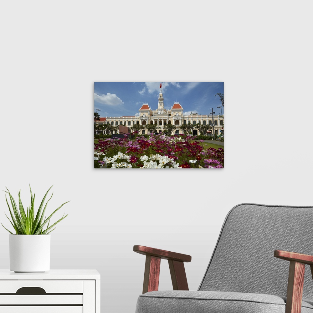 A modern room featuring Flowers and historic People's Committee Building (former Hotel de Ville de Saigon), Ho Chi Minh C...
