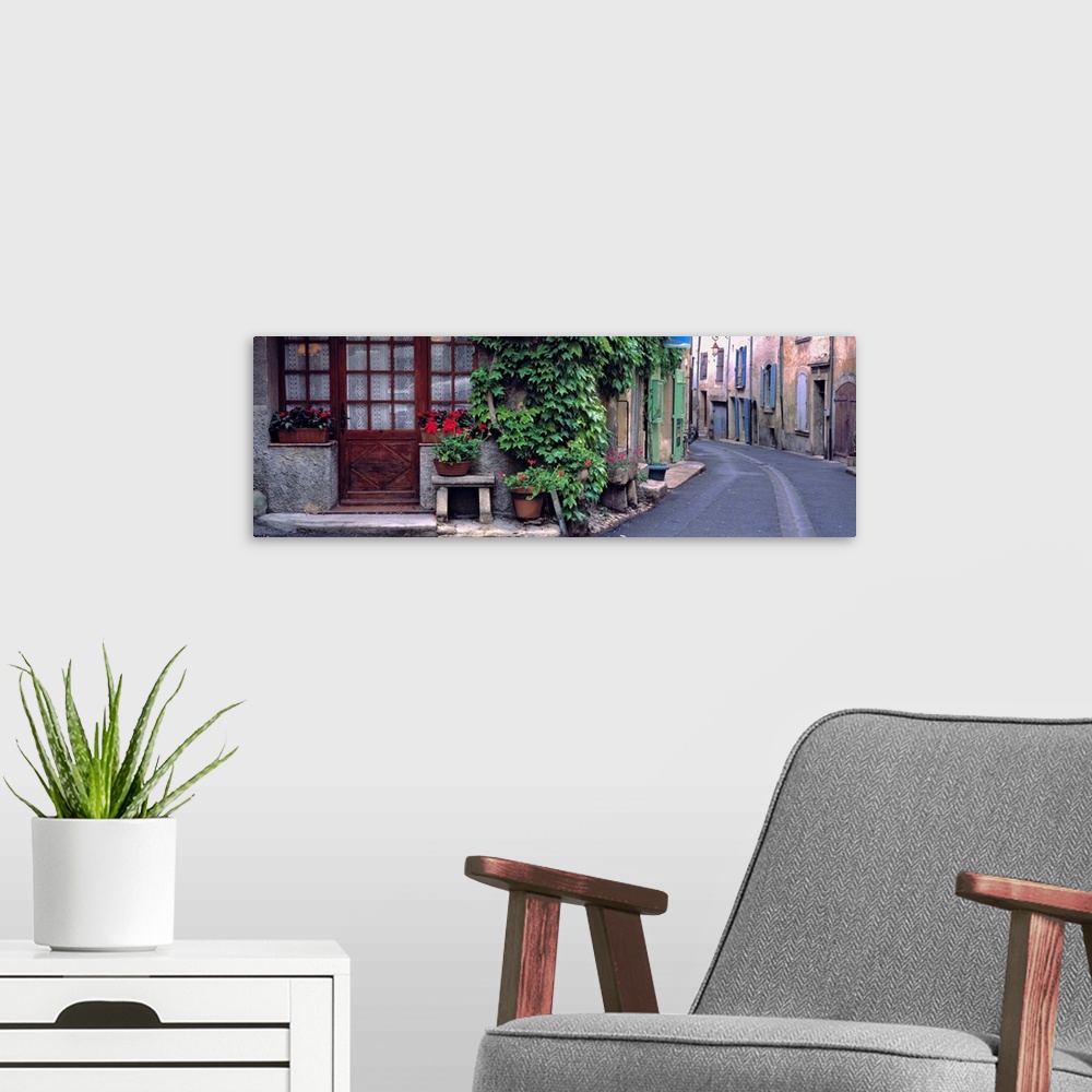 A modern room featuring Europe, France, Lourmarin. A quiet street scene in Lourmarin, France, reflects the essence of pro...