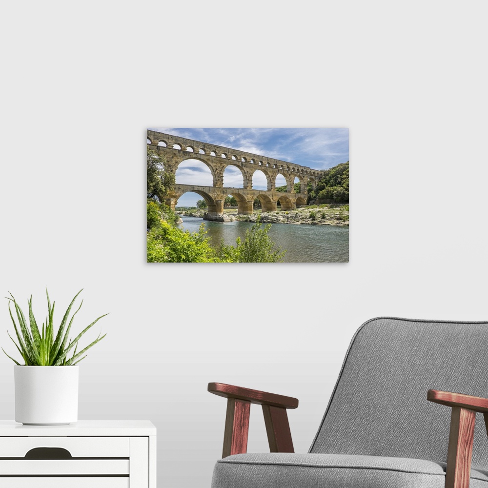 A modern room featuring France, Nimes, the Pont du Gard is an ancient Roman aqueduct bridge that crosses the Gardon River.