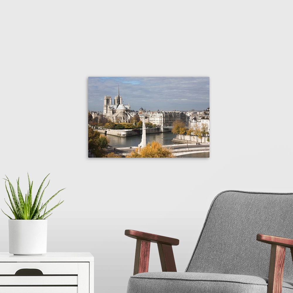 A modern room featuring France, Paris, View Of The Notre Dame And The Pont De La Tournelle Bridge