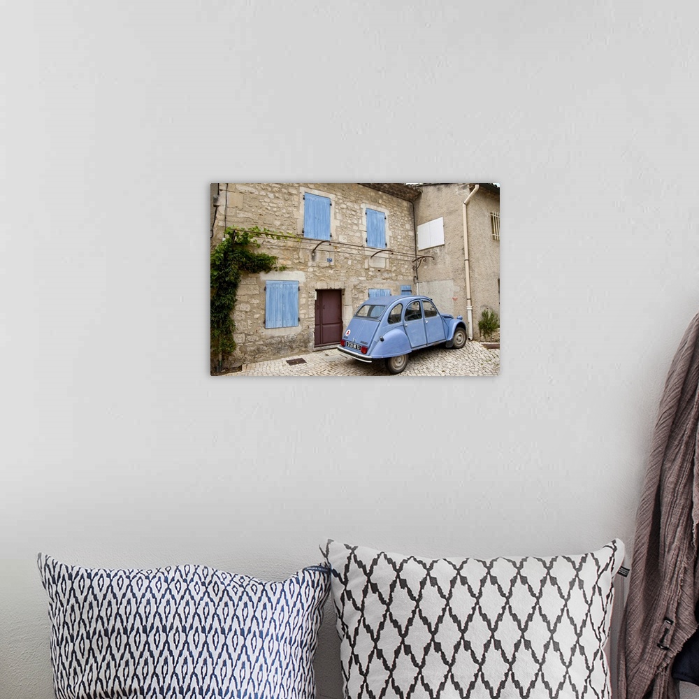 A bohemian room featuring France, Provence, St. Remy-de-Provence. Classic Citroen car sits outside building. Credit as: Fre...