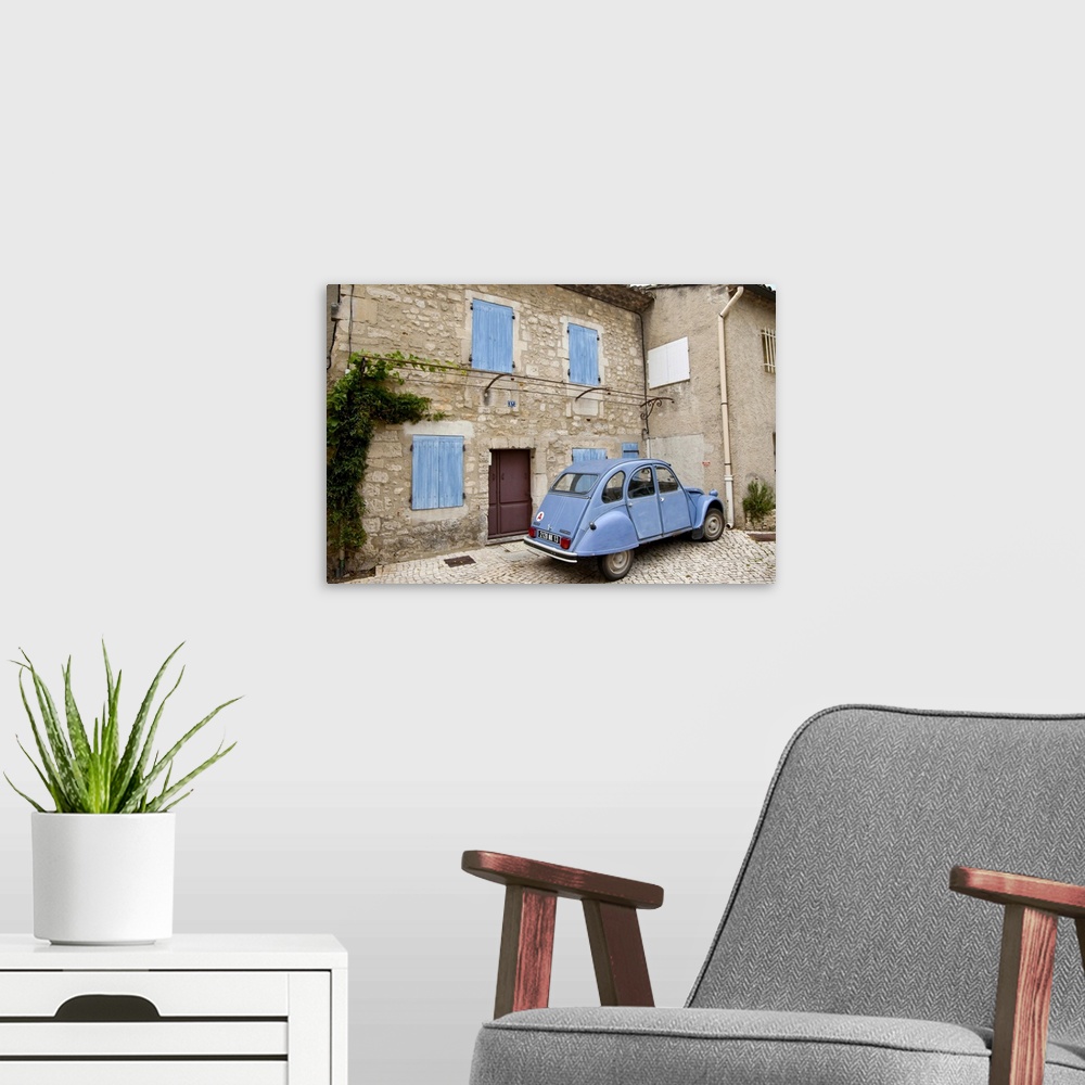 A modern room featuring France, Provence, St. Remy-de-Provence. Classic Citroen car sits outside building. Credit as: Fre...