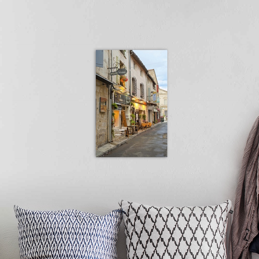 A bohemian room featuring France, Provence, St. Remy-de-Provence. Shops and restaurants line the street. Credit as: Fred Lo...