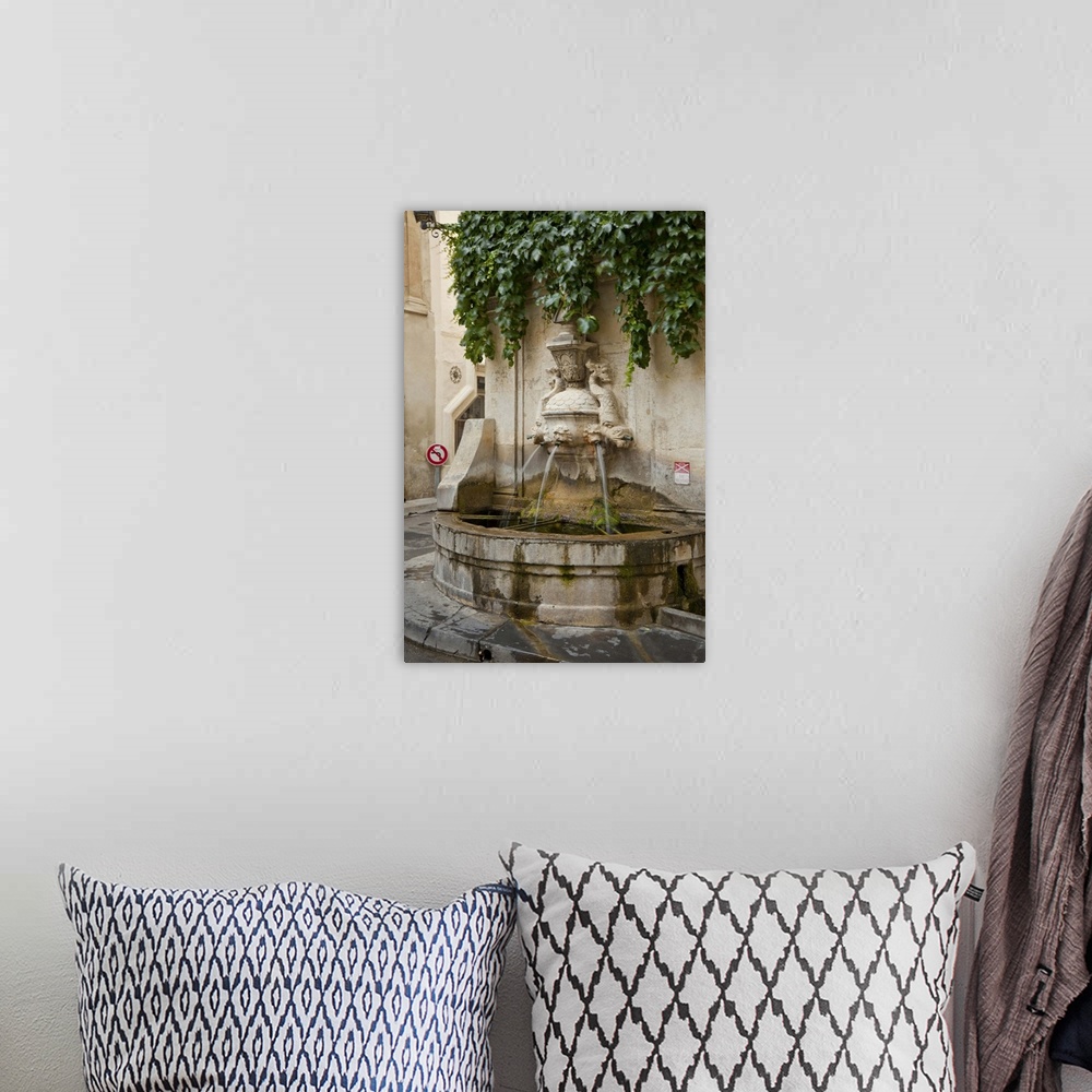 A bohemian room featuring France, Provence, St. Remy-de-Provence. Water fountain on street corner. Credit as: Fred Lord / J...