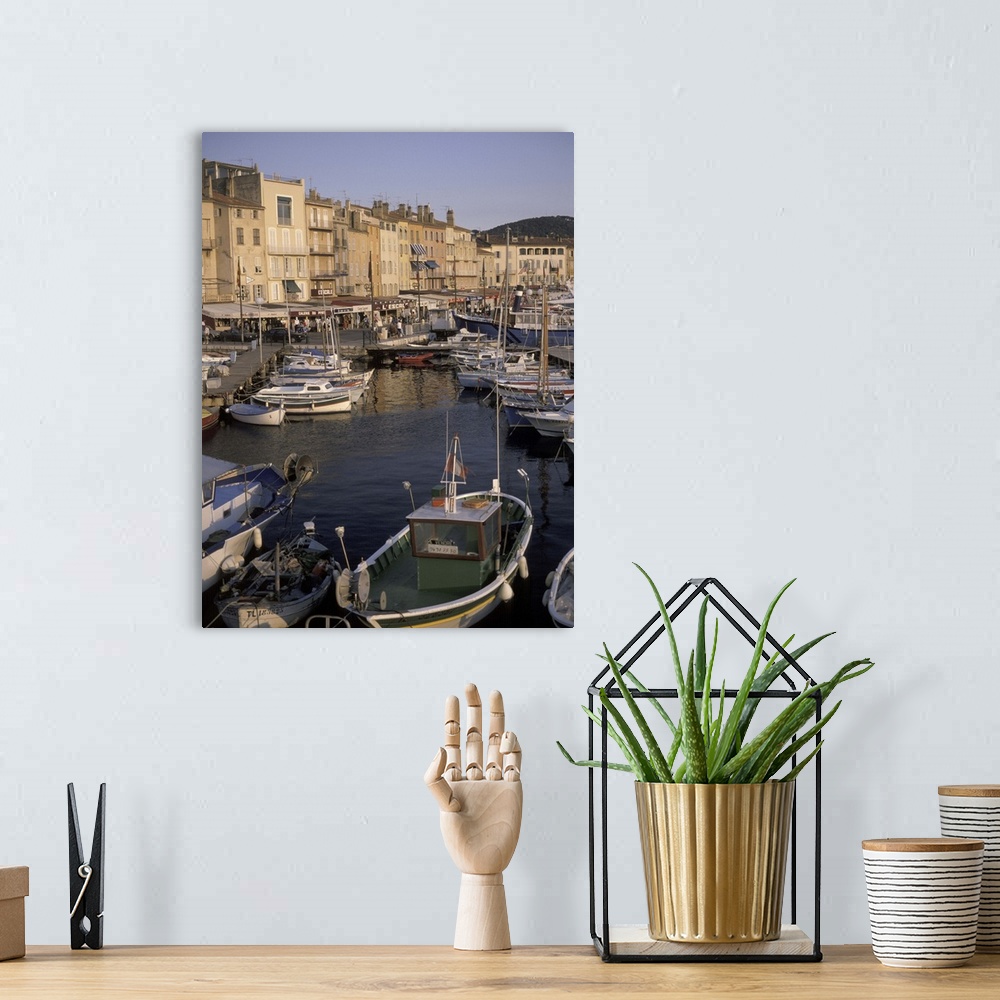 A bohemian room featuring Europe, France, St. Tropez.Boats moored in harbor