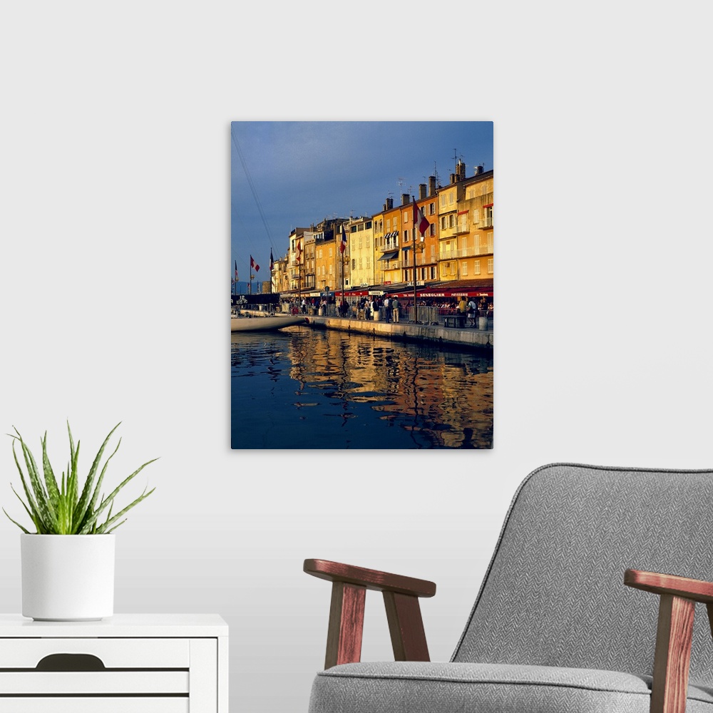 A modern room featuring Europe, France, St. Tropez. The cafes along the harbor are filled with people-watchers in St. Tro...