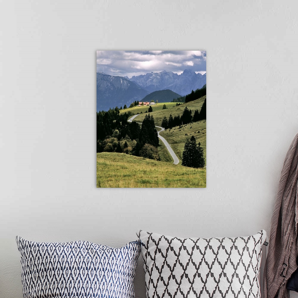 A bohemian room featuring Germany, Bavaria, Bayrischzell. A break in the clouds lets sunshine draw attention to this hamlet...