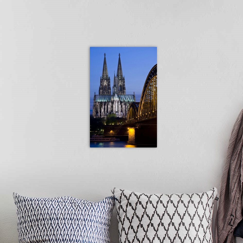 A bohemian room featuring Germany, Nordrhein-Westfalen, Cologne. Cologne Cathedral and Hohenzollern Bridge, evening.