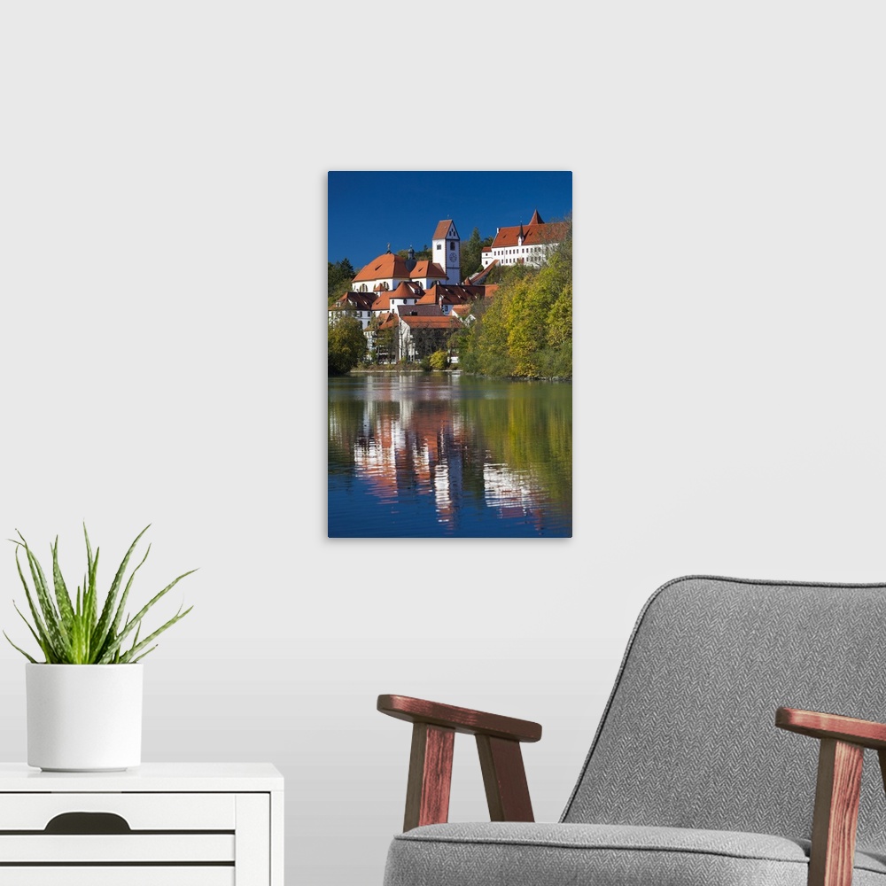 A modern room featuring Germany, Bavaria, Fussen, St. Mang Abbey and the Hohes Schloss Castle from the Lech River.