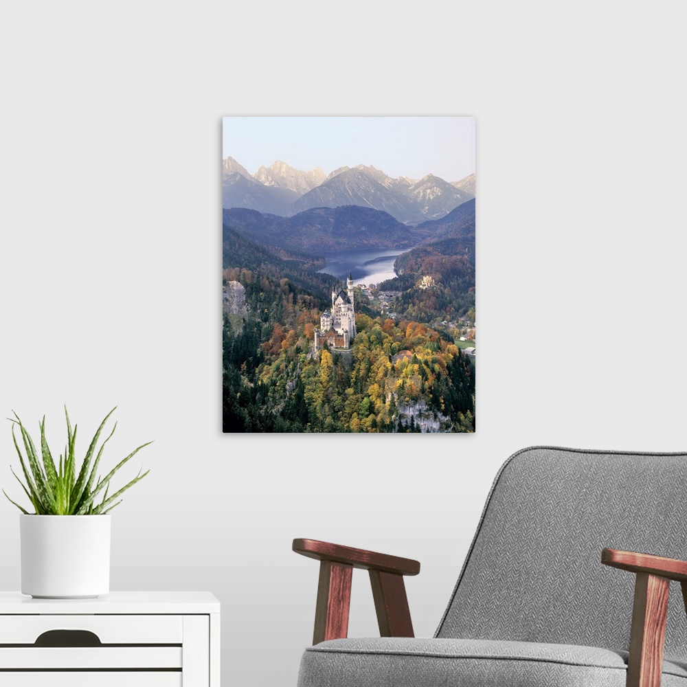 A modern room featuring Germany, Bavaria, Neuschwanstein Castle. Neuschwanstein Castle looms above the village and Hohens...
